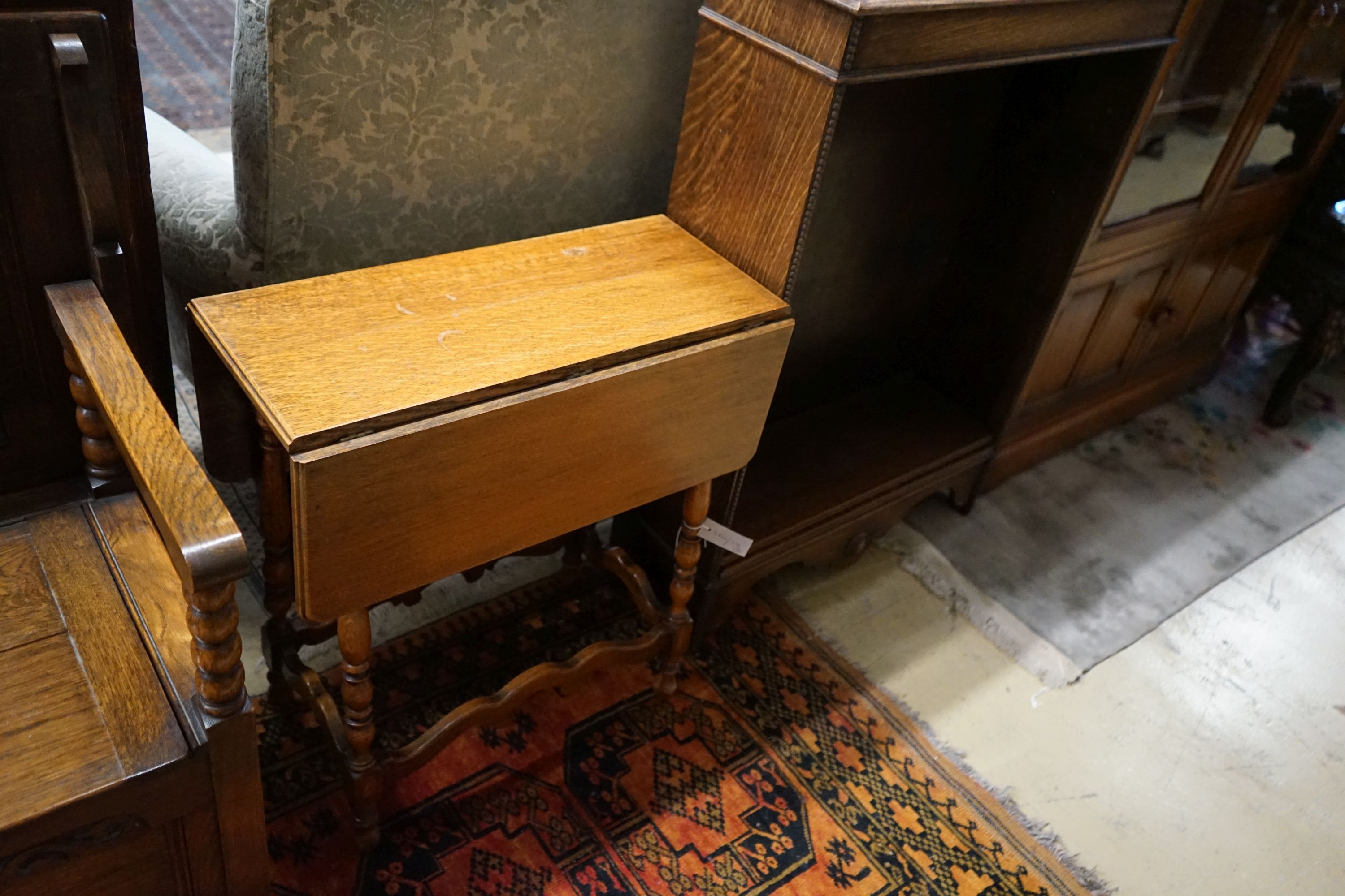 A small oak open bookcase, width 76cm, depth 27cm, height 109cm, together with a small oak gateleg occasional table